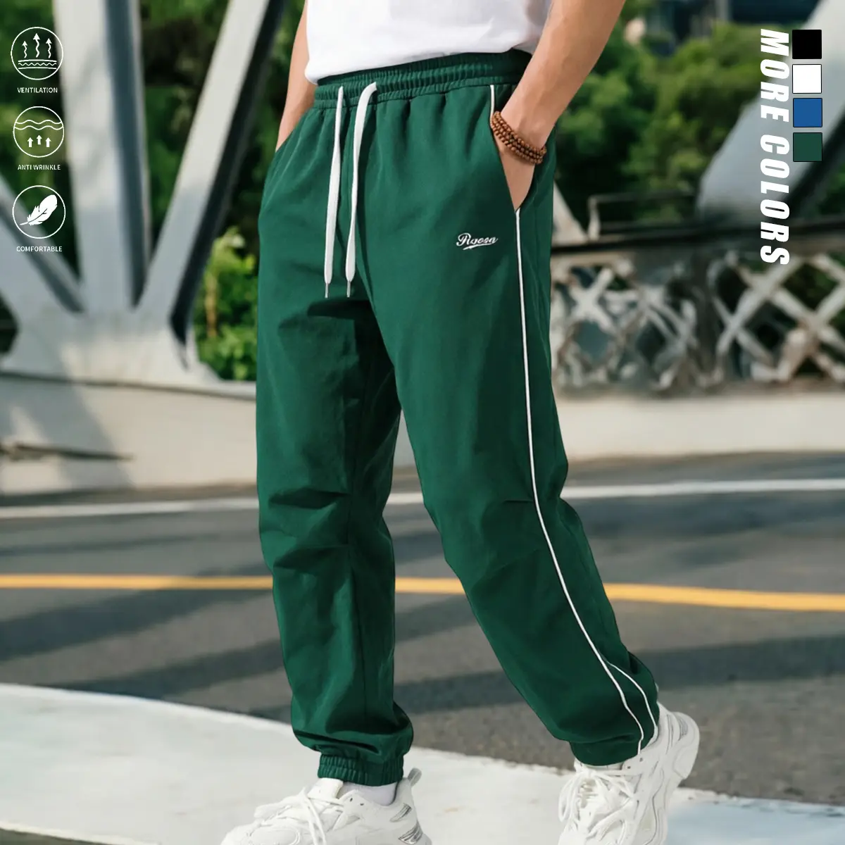 Premium polyester men’s casual athletic pants—moisture-wicking, wrinkle-resistant, lightweight; adjustable hem, dual drawstring waist, white side stripes, small embroidered logo; skin-friendly running pants suitable for men’s outfits for dates and outdoor