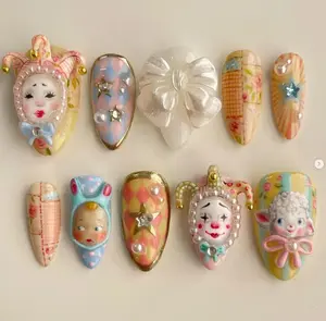 Whimsical vintage-inspired 3D nail art with clowns, bows, stars, and pastel patchwork patterns, perfect for a playful, nostalgic, and artistic statement look.