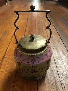 PORCELAIN BISCUIT JAR WITH ORNATE BRONZE HANDLE