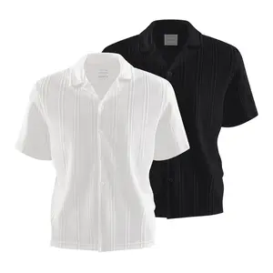 Men’s solid textured knit short-sleeve button-up shirt made from breathable fabric—ideal for casual occasions, summer outings, and relaxed urban looks; combines a minimalist style with all-day comfort.