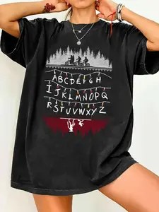 Stranger Things Christmas Alphabet Lights Graphic Print T-Shirt - Biking Teens & Demogorgon Pattern, Women's Oversized Crewneck Round Neck Short Sleeve Vintage Black Casual Fashion Comfy Tee, Summer Soft Fabric, Xmas Gift for Series Fans