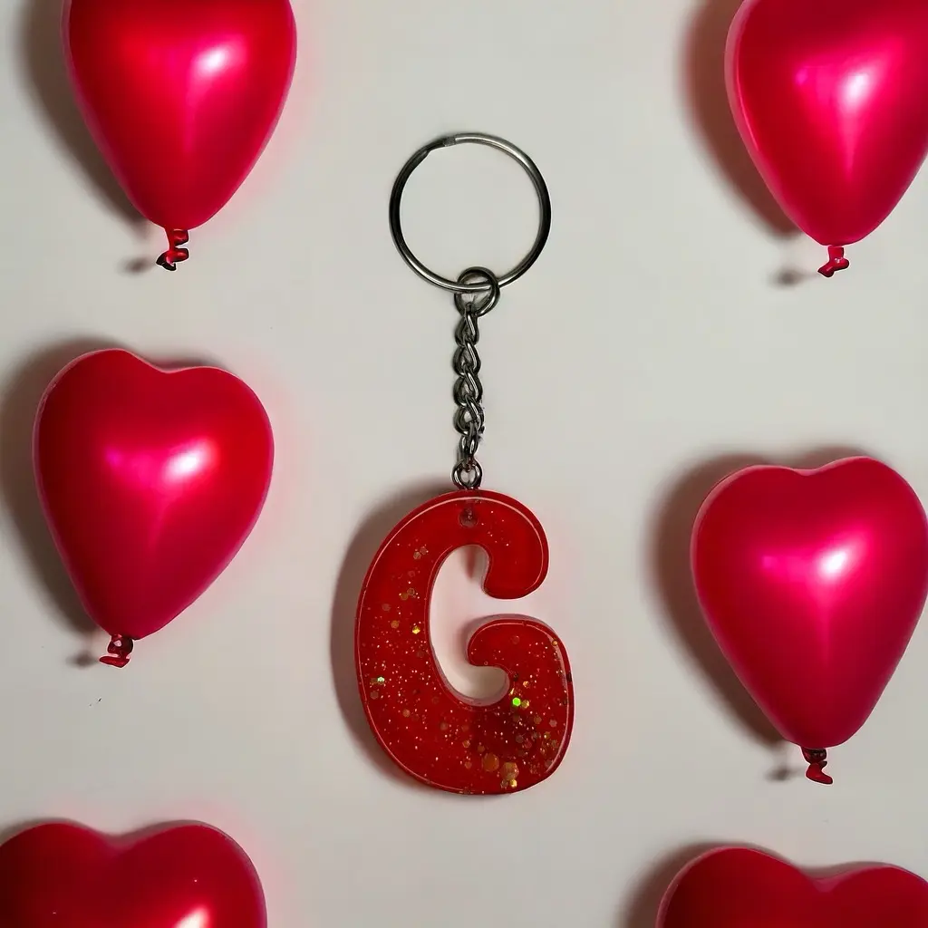 G Resin alphabet keychain red with glitter.