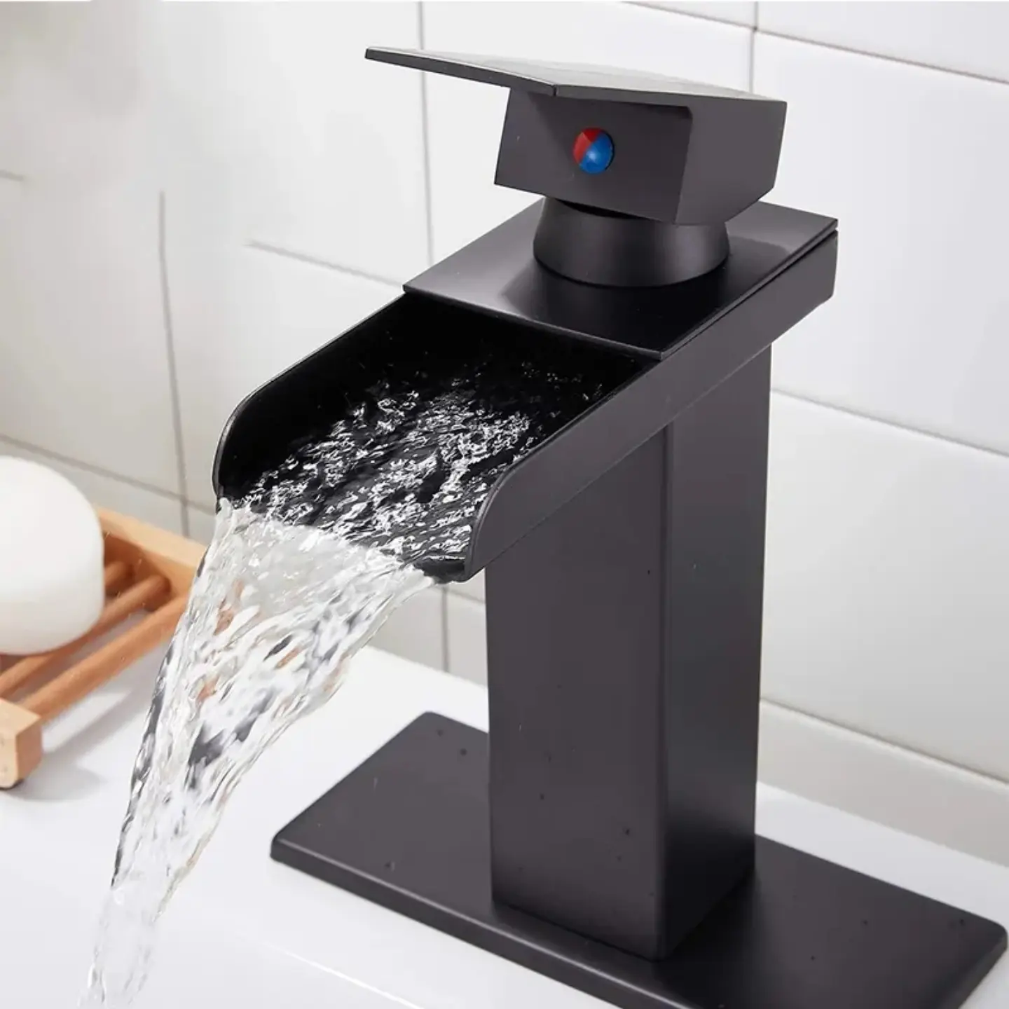 Upgrade your bathroom with this solid brass matte black waterfall faucet!  High quality, easy installation, and super satisfying water flow.   Hashtags: #bathroomdecor #waterfallfaucet #matteblack #brassfaucet #homerenovation #satisfying #bathroomupgrade
