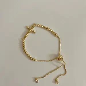 Gold Cross Bracelet with Beaded Chain and Adjustable Clasp for Elegant Everyday Wear