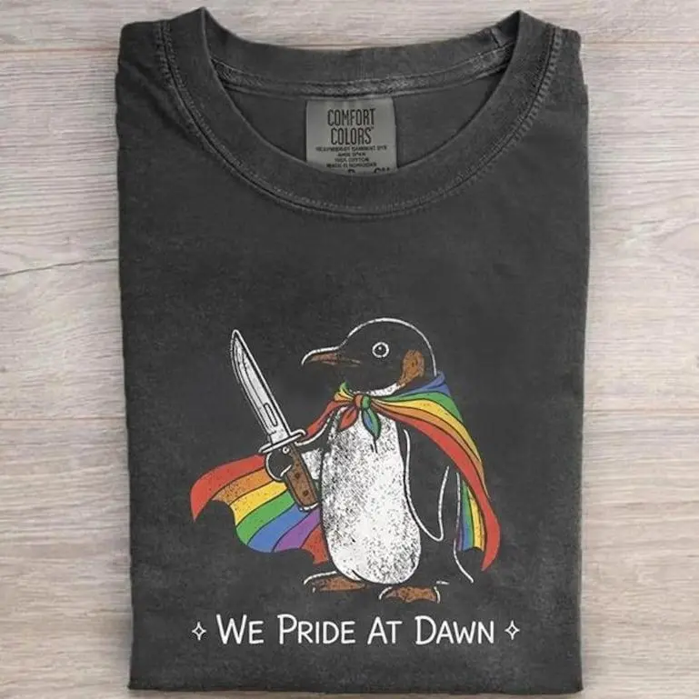 We Pride At Dawn Shirt, Funny Penguin Pride Month Tee, Rainbow Cape Knife LGBTQ Gift, Retro Creative Penguin Graphic Comfort Pepper T-shirt