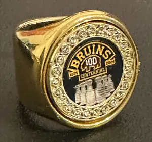 The BOSTON BRUINS CENTENIAL deCAPitator ring bottle cap & can tab opener, busts open your favorite beverage with a flick of the wrist. Golfing merchandise; Golf gift; PGA merchandise