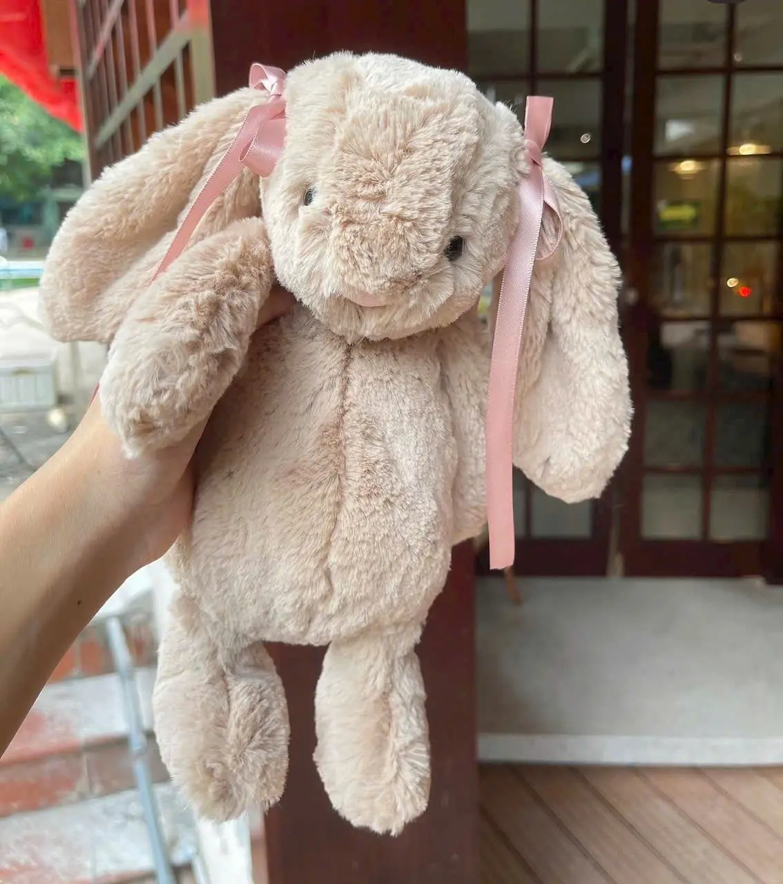 Jellycat plush bunny toy in beige and white, size M