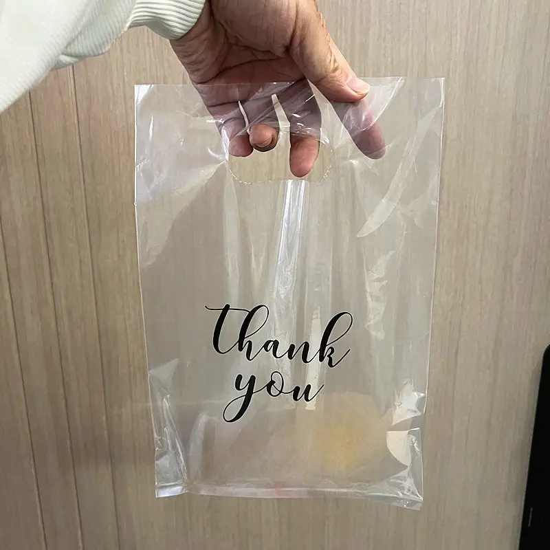 100pcs Transparent Plastic Handheld Bags Printed with THANK YOU, Suitable for Gifts, Clothing and Cosmetics. Stylish and elegant, ideal for daily use, parties and commuting. Great gifts for family and friends. OPP bags for Thanksgiving and Christmas packa