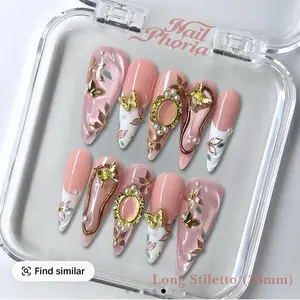 Nail Phoria Long Stiletto 33mm Nails with Elegant Gold and Pearl Accents for a Luxurious Look