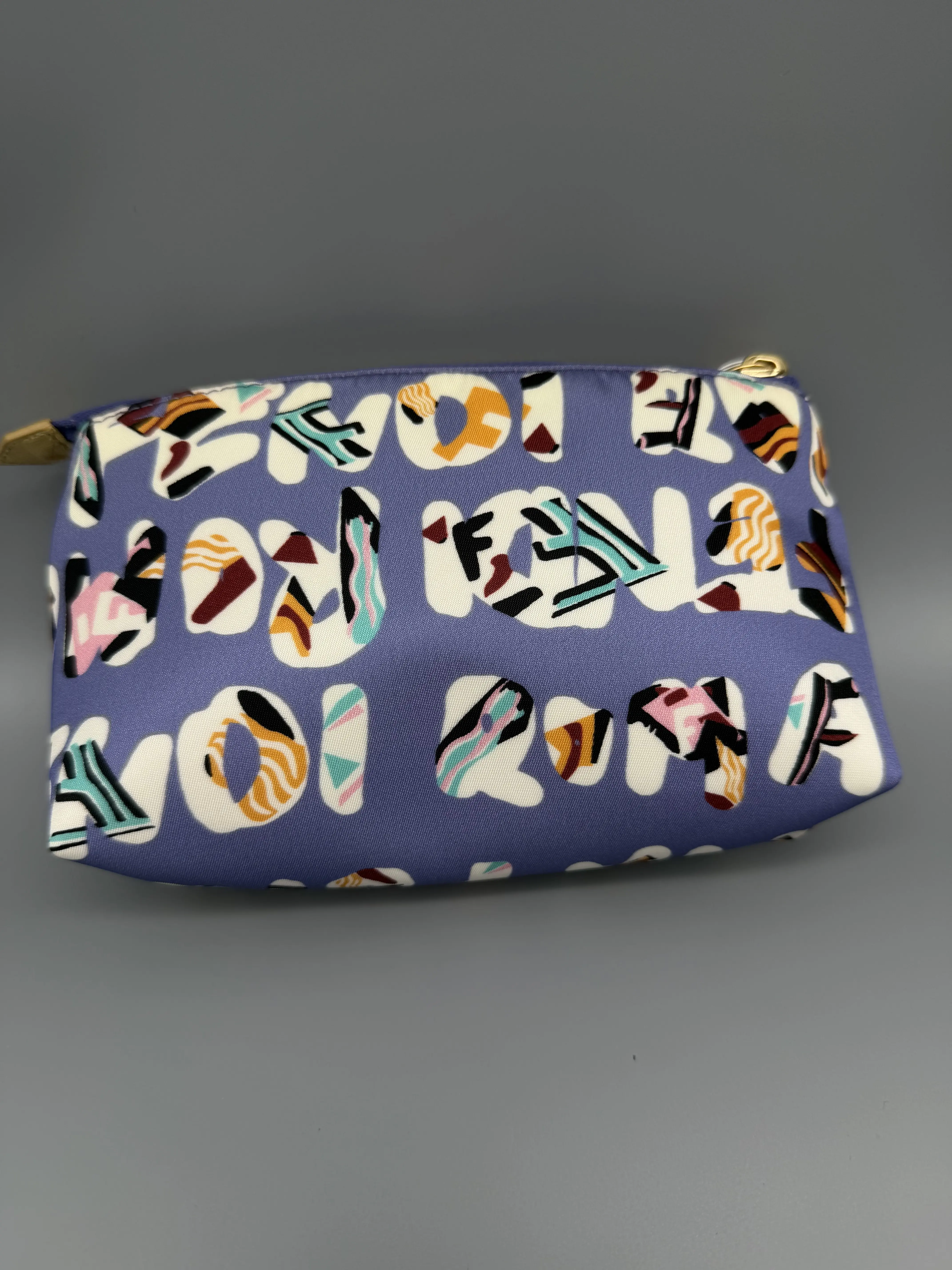 Pre-owned FENDI Nylon Small Leather Goods Typographic Cosmetic Pouch Small Leather Goods, Zip Closure Travel Bag for Beauty Products, Cosmetics, Lavender Multicolor Logo Print Case