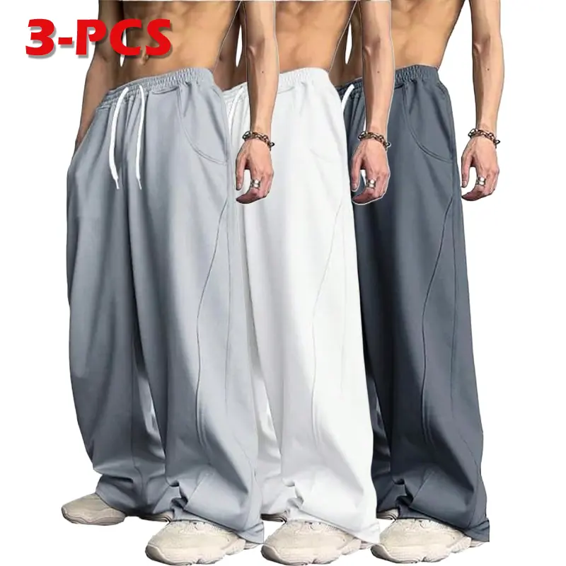 Men’s fleece-lined warm athletic pants with a loose drawstring waist—fashionable menswear suitable for everyday wear in autumn and winter.