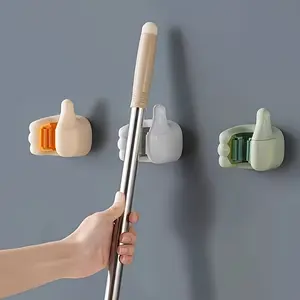 1pc No Drill Wall Hanging Clip for Brooms & Mops - Strong Adhesive, Fashionable Plastic Design, Random Color (White/Green/Orange) - Space-Saving Bathroom & Utility Room Storage Rack, Secure Broom Holder, Thumbsup Design, Adhesive Installation, Utility Ho