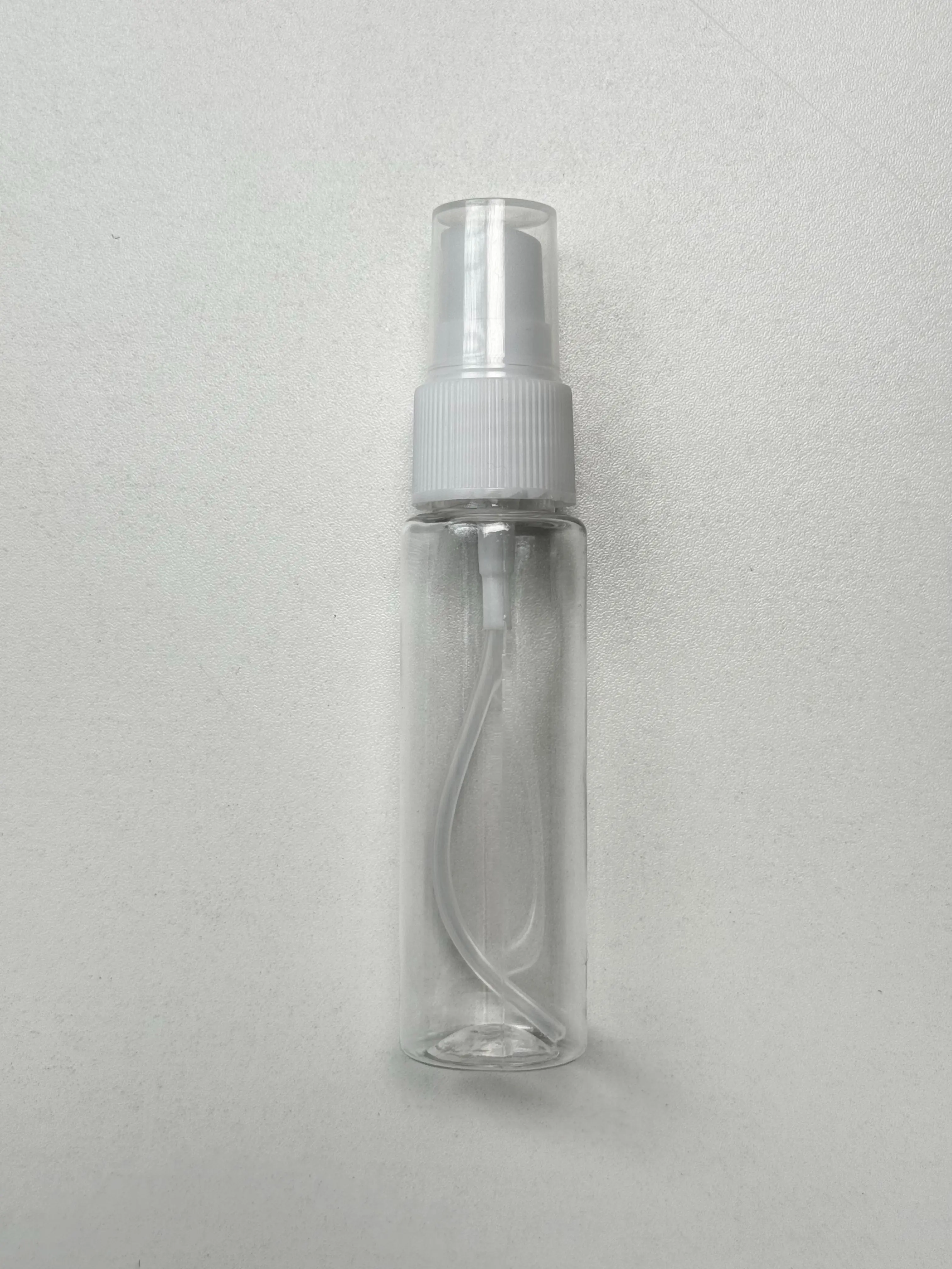 Sleek Black Plastic Spray Bottle, Refillable Fine Mist Atomizer with Cap, Portable Container for Travel and Hair Styling, Plastic Bottles, Refillable Spray Containers