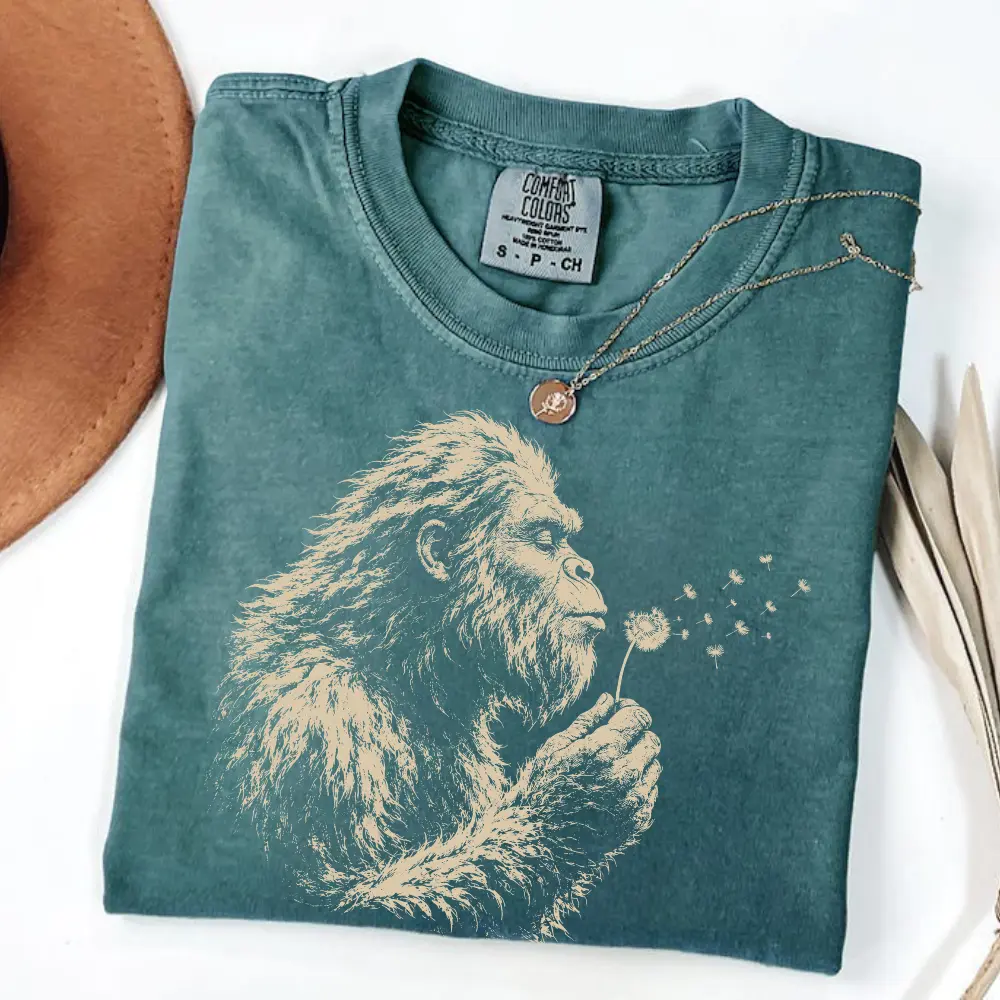 Comfort Colors  BlueSpruce Bigfoot Dandelion T-Shirt, Vintage Sasquatch Nature Tee, Woodland Cryptid Graphic T-Shirt, Outdoor Adventure Shirt, Bigfoot Lover Gift