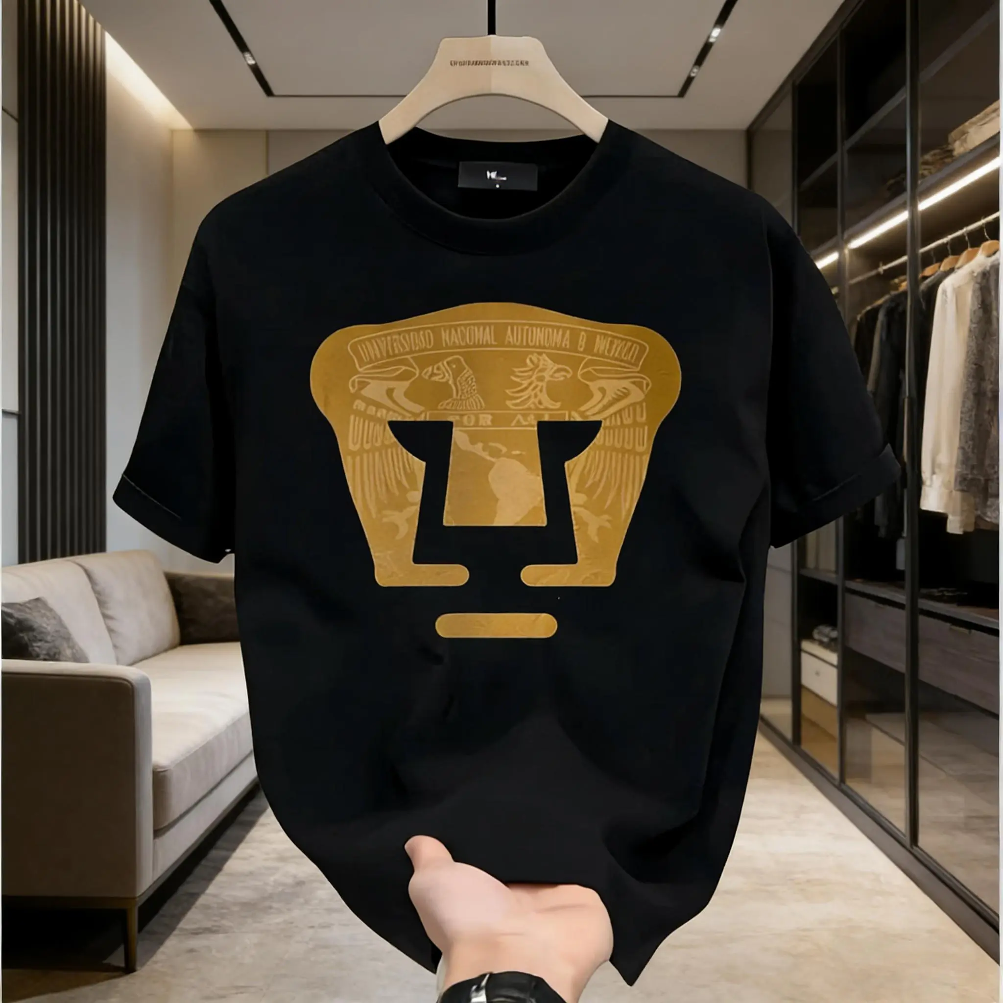 LIGA MX PUMAS UNAM Football Club High-Quality Sweatshirt Black Pullover Stretch Menswear Tops Crewneck Short Sleeve T-Shirt with Gold Emblem and Text for Casual Wear