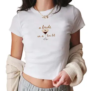 [Sale Up To 40%] A Bride In A Tini Bit Baby Tee, Martini Bachelorette Party Top, Martini Bride Tee, Gift For Bridesmaid, Trendy Y2K Bride To Be Shirt