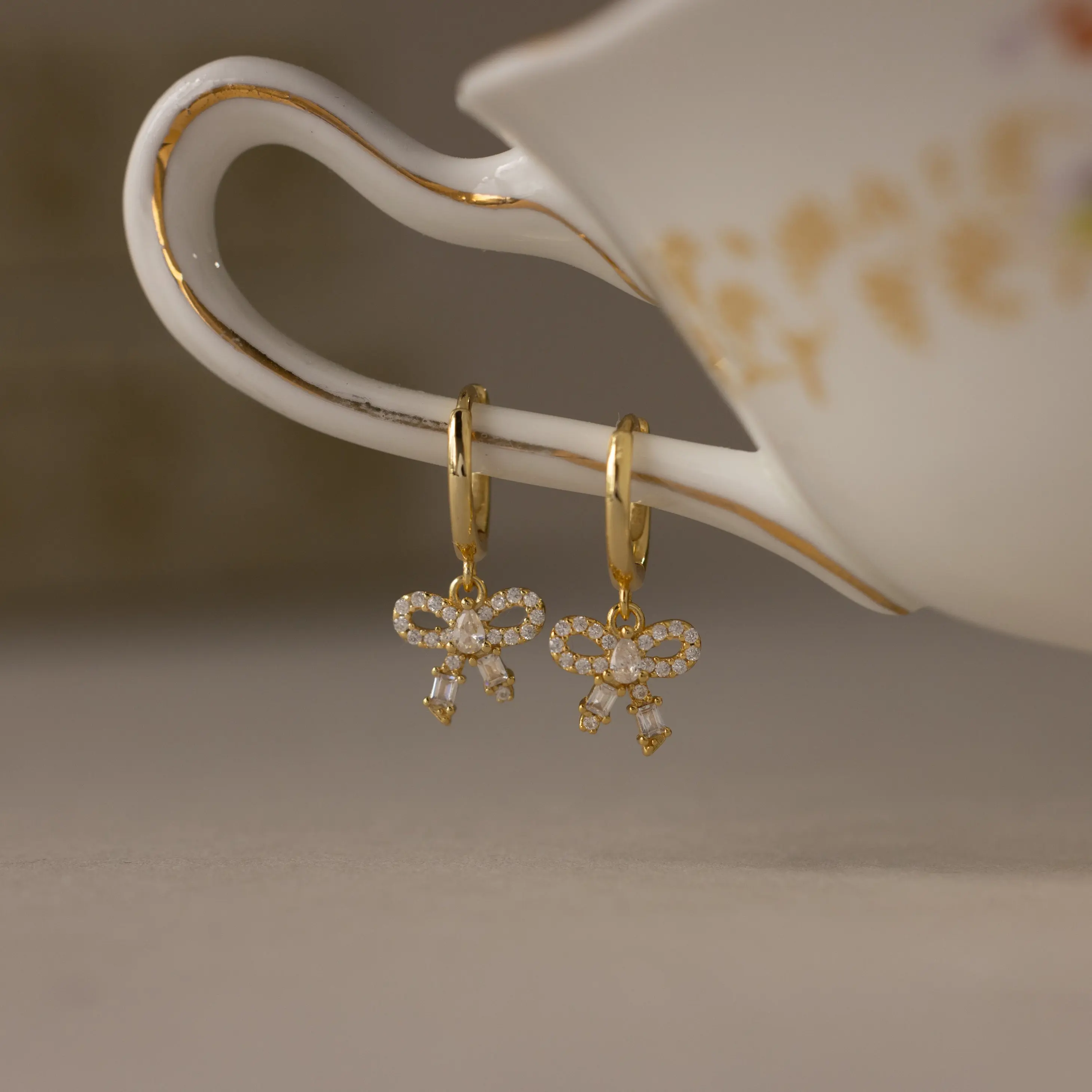 Pave Bow Charm Hoops by Caitlyn Minimalist - Dangling Crystal Ribbon Bow Earrings - Coquette Diamond Earrings - Trendy Jewelry - Daughter Gift