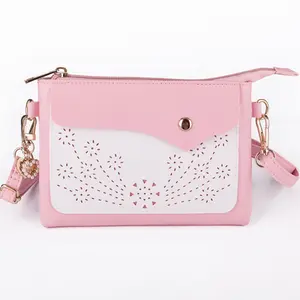 Mini crossbody bag for girls aged 8–14; cute laser-cut small purse handbag with wrist strap for kids, teens, and tweens; pink crossbody purse; small cell phone wallet clutch for school and shopping, Girl, Pu Leather