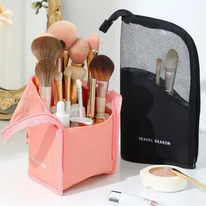 A large-capacity, upright makeup brush organizer bag with multiple compartments. This portable cosmetic storage bag features a convenient design for easy access and a zippered closure, making it suitable for both travel and home use. Travel Cosmetic Bags
