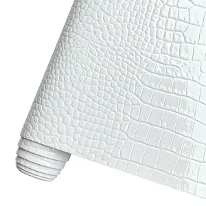 Glossy embossed crocodile-patterned PU faux leather roll, 11.81 x 53 inches, perfect for handmade crafts, leather earrings, and various DIY projects. In stock at overseas warehouses.