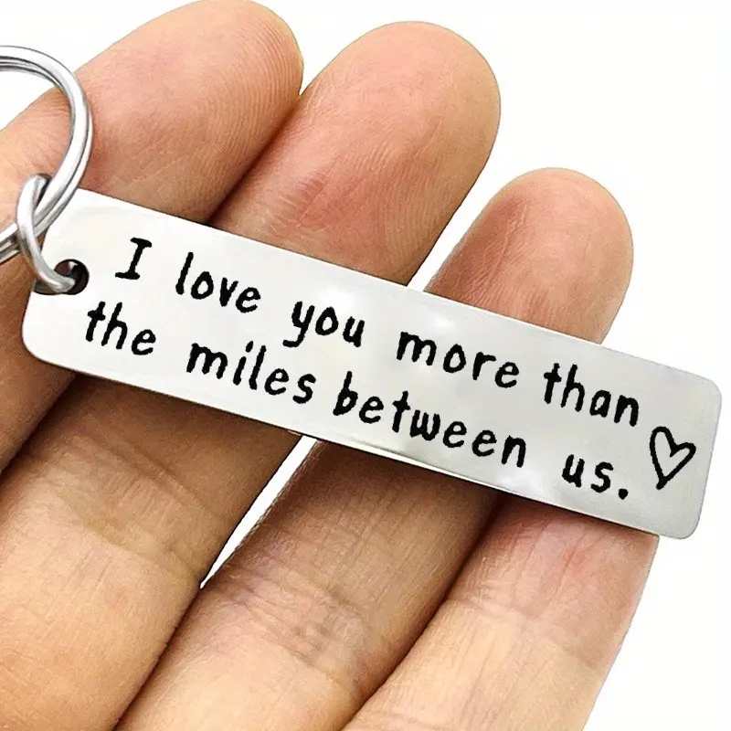 1pc stainless steel keyring, a long-distance relationship keyring for couples, a gift for your boyfriend or girlfriend featuring the message "I love you more than the distance between us", perfect for anniversaries or Valentine's Day.