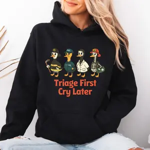 [Made in USA] Triage First Cry Later Hoodie, Funny Medical Duck Graphic Pullover Hoodie, Spooky ER Nurse EMT First Responder Oversized Hoodie, Triage First Cry Later Halloween Outfit, Gift For Women Men.