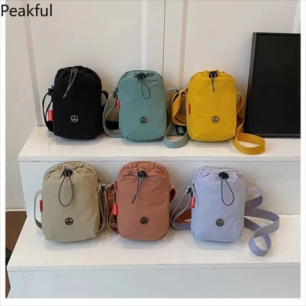 Viral Mini Drawstring Nylon Sling Bag, Fashion Casual Cinch Crossbody Purse, Lightweight Adjustable Strap Shoulder Bag, water-resistant fabric & multi-color options, ideal for travel, gym sessions and everyday hands-free use