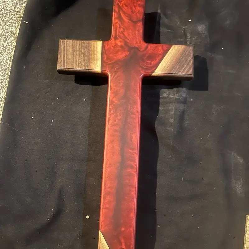 Crosses made with black walnut hardwood and red epoxy.