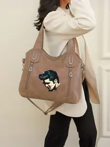 This leather tote bag features an Elvis Presley design and a zip closure. It's perfect for the back-to-school season and a great New Year's gift.