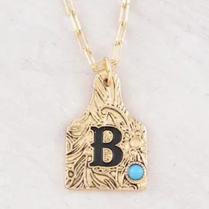 Initial Cattle Tag Pendant Necklace Gold Tone with Blue Gemstone Letter B Pendant 18" Chain Lobster Claw Closure Extending Hooks Unique Piece Subtle Elegance