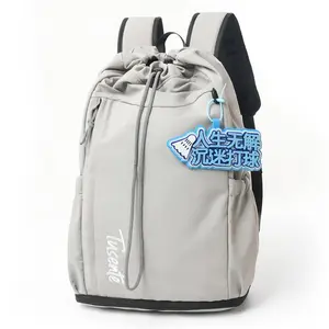 Nylon drawstring backpack with contrasting color straps and accessories