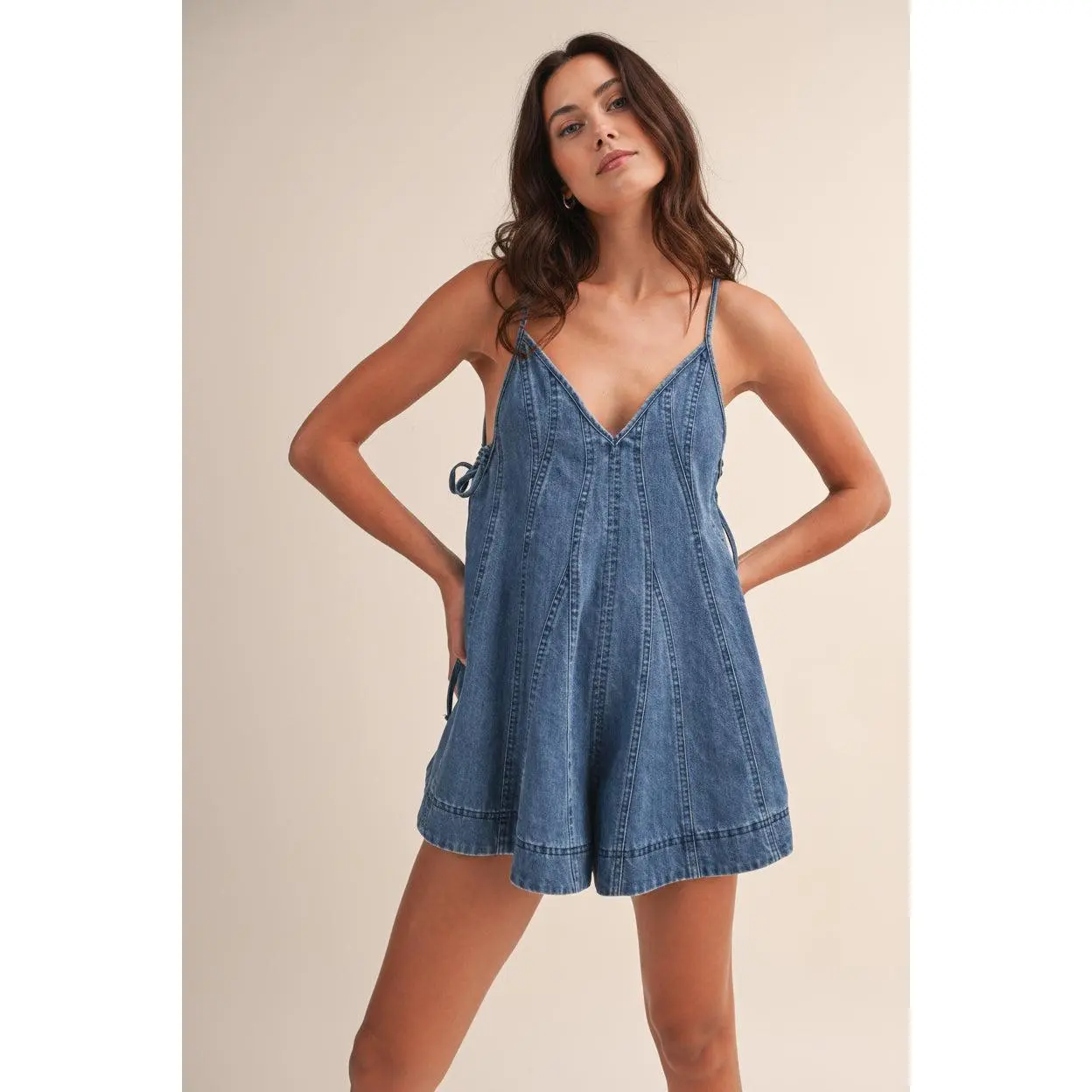 DENIM FLARED ROMPER WITH SIDE TIE DETAIL