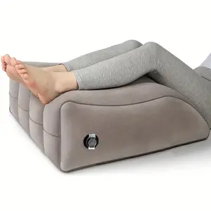 Inflatable leg elevation pillow for comfort and support, beige, adjustable height, soft wedge-shaped cushion, medium firmness, ergonomic design for sleeping and reading