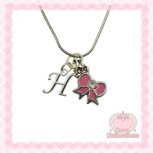 handmade silver princess initial charm necklace by kora kollections with plated chain