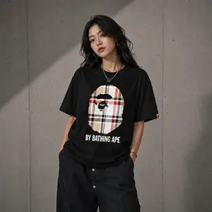 A Bathing Ape Check by Bathing Tee - Black T-Shirt with Iconic Ape Head Design and Plaid Pattern for BAP3 Enthusiasts