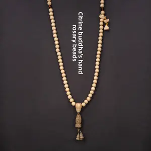The 1.0-bead rosary bracelet ornaments (long string) made of Wutai Mountain Liudao wood, Xianglong wood and yellow crystal with small Buddha's hand design