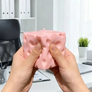 pink cheese block, a stress-relieving toy filled with flour, soft and bouncy to the touch.