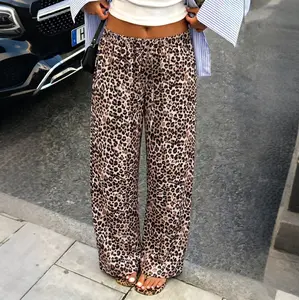 Women’s leopard print wide-leg pants with an elastic drawstring waist, made from a soft, drapey fabric. Loose straight-cut casual trousers that are lightweight, breathable, and relaxed—ideal for everyday wear, vacations, and home leisure.