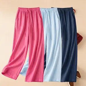 Women’s three-piece set featuring lightweight, drapey wide-leg pants; casual long pants with pockets; breathable beach vacation leisure pants.