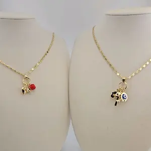 (40 ) #1 #2. Buena suerte pendant and chain 18k Gold laminated  2 styles.