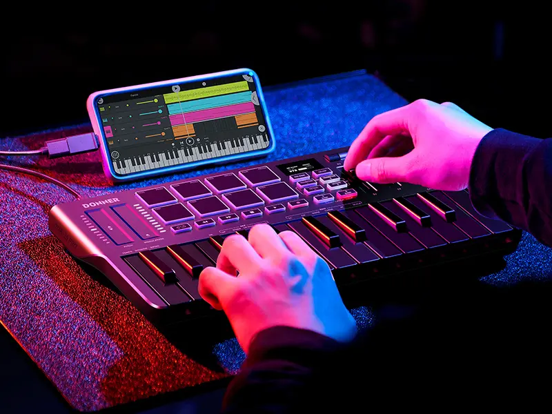 Donner DMK25 Pro Digital MIDI Keyboard Controller - 25 Mini Keys, Lightweight Compact Portable USB-C MIDI Keyboard, 8 Drum Pads, OLED Display, Personalized Touch Bar, Music Production Software, 40 Free Courses for Studio & Cafe Use, Electronic, Plug In, S