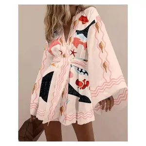 A Beach Dress for Women Featuring Pink And White Marine Elements, Adorned with Seashells And Various Oceanic Designs, Decorated with Pink Wave Patterns, Designed in a Kimono-Style with Wide Sleeves, Perfect for a Seaside Getaway