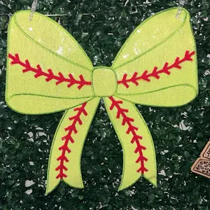 Woman’s sequin softball coquette bow on your choice of a unisex Gildan pullover sweatshirt