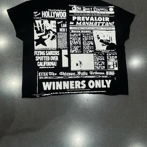 Prevaloir Newspaper Tee