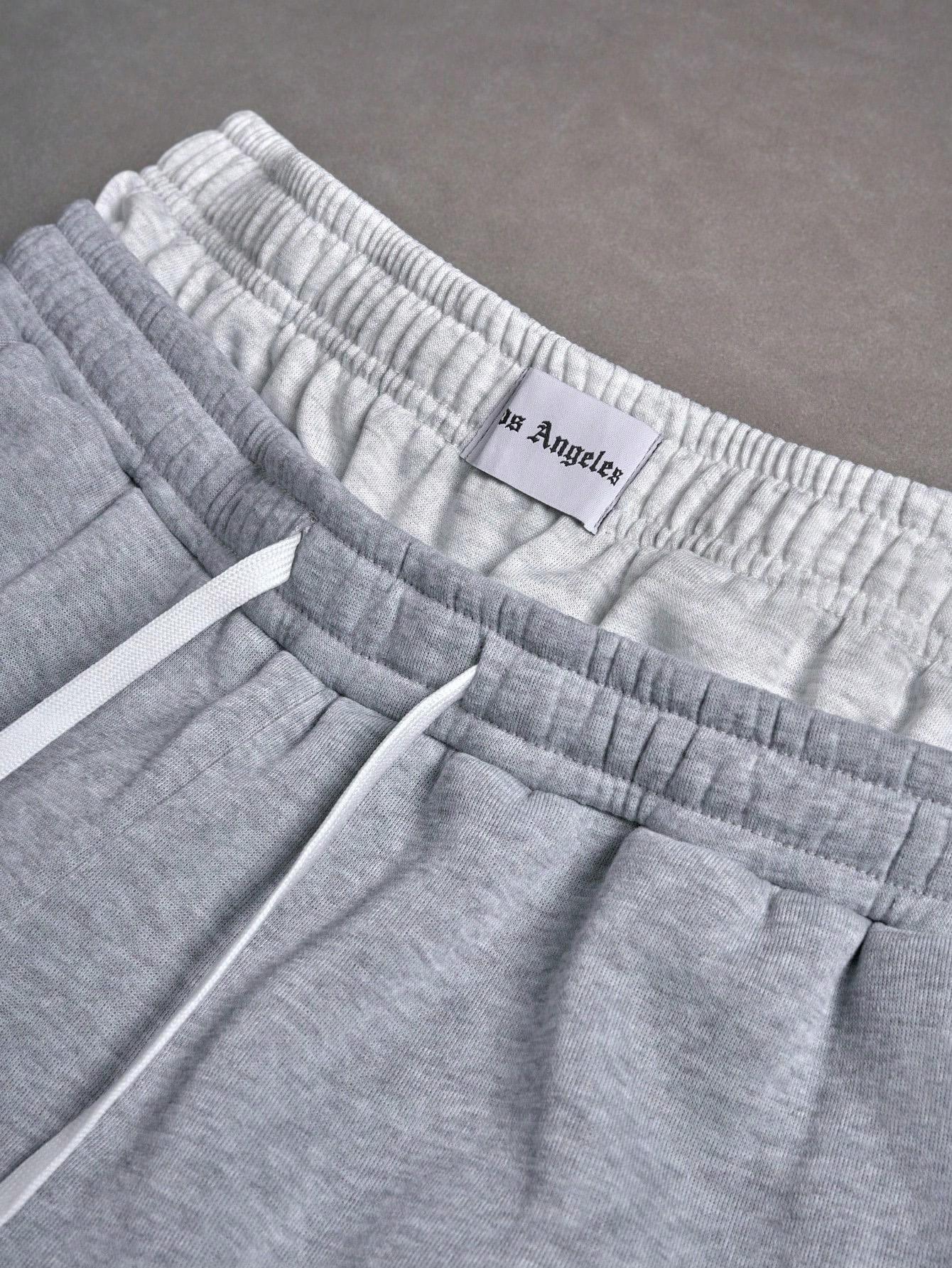 Unisex Y2K street-style sweatpants with logo embroidery; men’s shorts featuring a unique double-waist design; embroidered print loose hip-hop streetwear shorts for summer sports—ideal for everyday wear, comfortable and versatile.