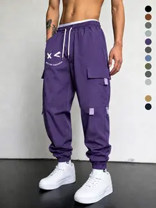 Men’s loose casual cargo pants made from skin-friendly, breathable, wrinkle-resistant fabric; drawstring waist design; American letter print; practical multi-pocket design; retro casual style; suitable for everyday wear, going out, and campus outfits.