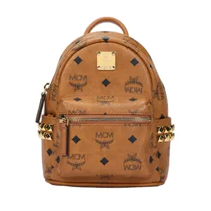 MCM Stark Mini Backpack with Coated Canvas and Leather Trim, Featuring Classic Double-Sided Rivet Decor, Unisex Couple Style in Brown Cognac