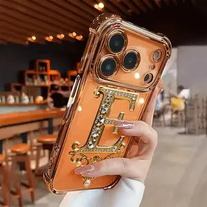 Creative diamond and gold "E" pattern, drop-proof and non-slip TPU full-coverage lens-plated phone case, compatible with iPhone 17, 16, 15, 14, 13, 12, 11, XS, X series and other models. Makes a great gift for friends or family.