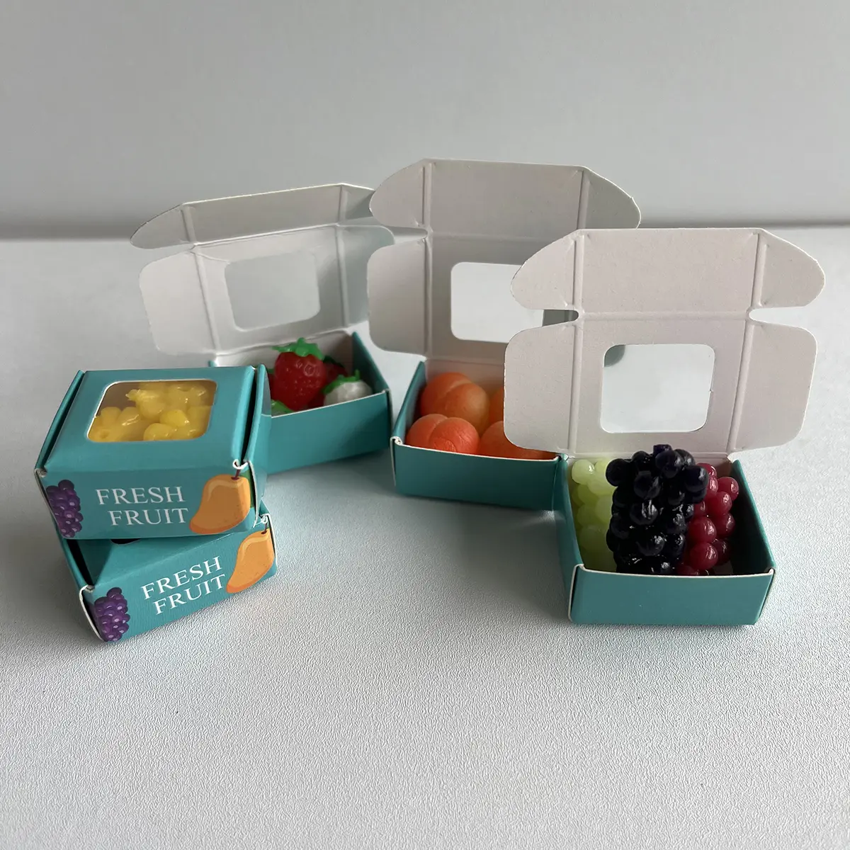 20 PCS Mini Squishy Fidget Toy Set with 4 Fruit Display Boxes - Squishies, Miniature Things, Pocket Squeeze Toys, Stress-Relief Desk Decor, Collectibles, Car Ornaments, Holiday Gifts