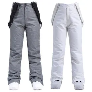 New ski pants for men and women, suitable for single or double boards, windproof and waterproof, with a detachable elastic waistband, thickened warm cotton pants for men.